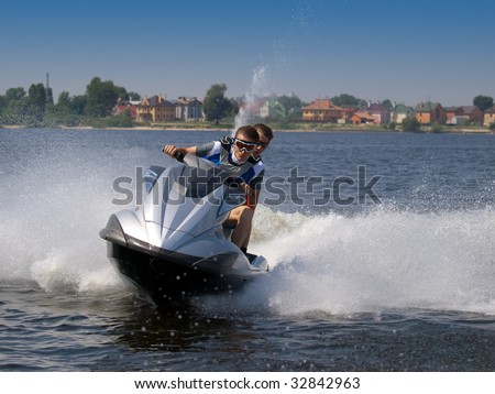 Couple men on jet ski in the river turns left