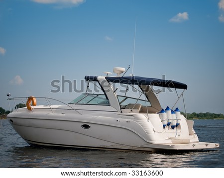 Luxury boat on river against a blue sky