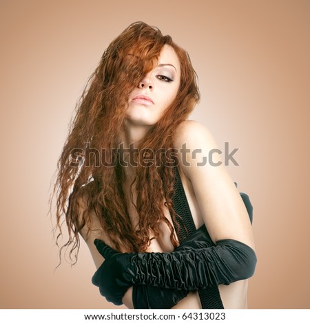 sensuality red-haired girl on beige tone