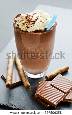 Sweet milkshake with chocolate black background