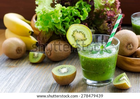 Green healthy kiwi tropical smoothie with ingredients