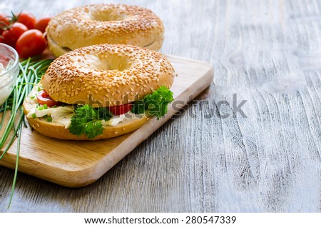 Bagels sandwiches with cream cheese, tomatoes and chives for healthy snack