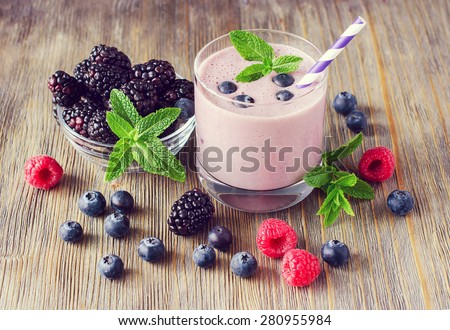 Smoothie with blackberries, raspberries and blueberries, healthy summer dessert, milk shake