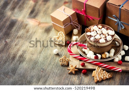 Winter hot drink, cacao with marshmallows and christmas cookies, spicy hot chocolate copy space festive vintage background