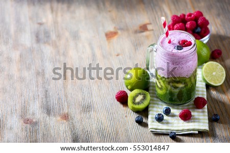 Smoothie with berries and kiwi, healthy drink, detox, diet or vegan food concept, fresh vitamins copy space background