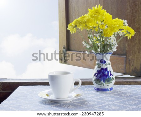 coffee and flowers side of window