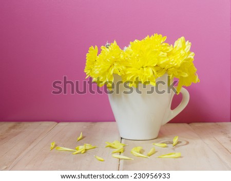 yellow Flowers in tea cups