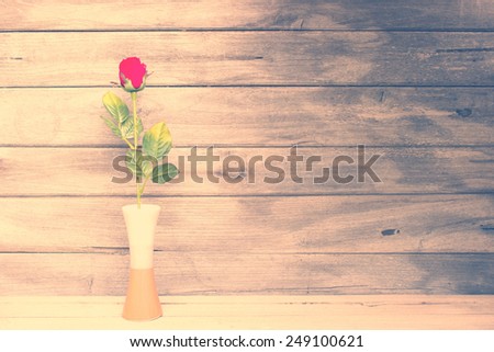 Vintage,still life rose flower on wood