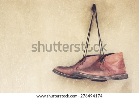 Vintage,Leather shoes hanging on the wall