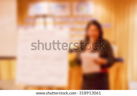 Abstract blurred people presentation  in seminar room, education and business concept