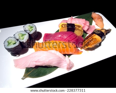 Sushi is luxury authentic Japanese food, isolated on black background