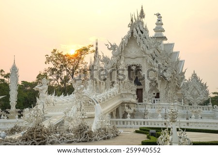 White temple with evening sky is unique beautiful Thai art in Chiangrai