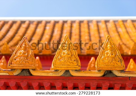 Respect angel sculpture on roof tiles of Marble temple in Bangkok, Thailand
