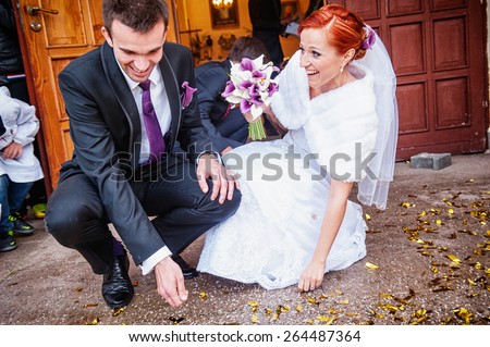 an image of bride and groom in front of church