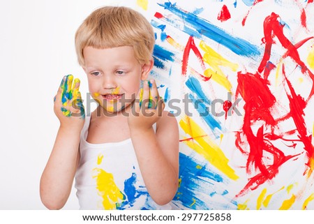 Little kid draws bright colors. School. Preschool. Education. Creativity. Studio portrait over white background