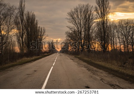 Ukrainian country road at the sunset.