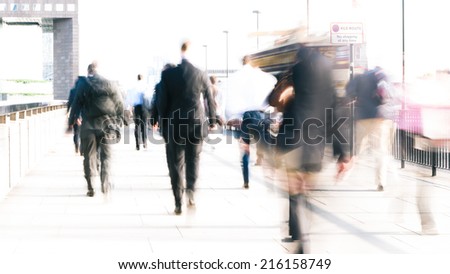 Long exposure, high key abstract captures of anonymous London City workers on their way to the office.  Intentional creative motion blur to indicate movement.
