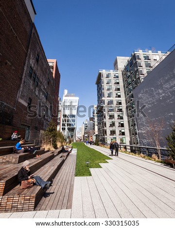 NEW YORK CITY, USA - 27 MARCH 2012: Candid view of the High Line park  above the streets of New York City on a bright spring day.