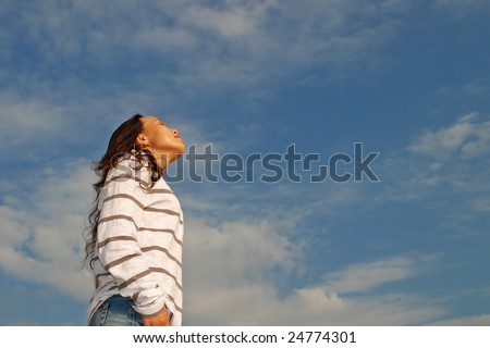 Young Woman taking deep breaths to relax, more shots available in the same series...