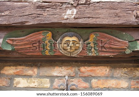 Carved face on wooden beams from Hans Raffns house from the Middle Ages, angel house in Ystad