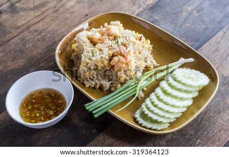Fried rice with shrimp on the wooden background. thailand food.Thai fried rice with prawns