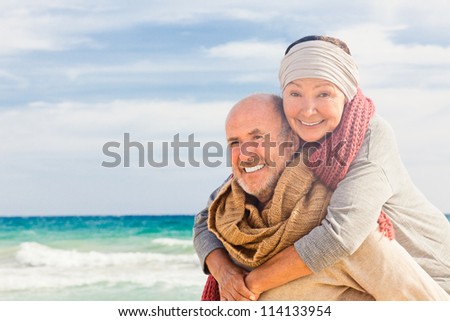 happy senior couple hugging enjoying retirement