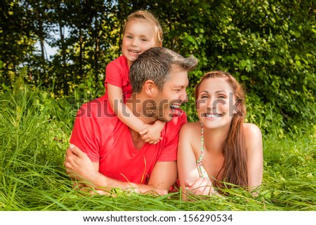 happy family laughing with child
