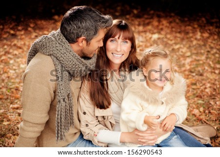 happy autumn fall family in woods