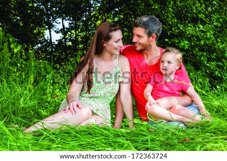 joyful family members in green park