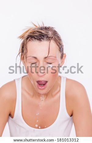 face cleaning female with water refreshment