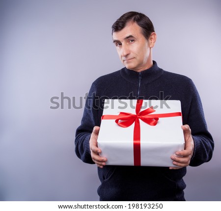 man with big present for christmas