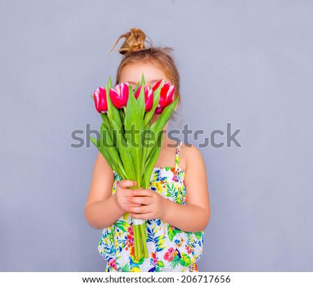 little cute holding bouquet as present for mother father day