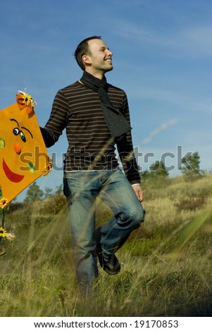 man walking with kite