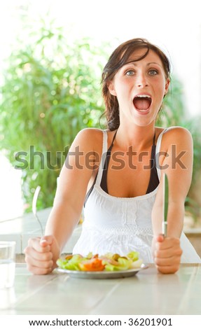 Woman sitting in park restaurant eating healthy food nutrition
