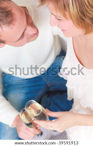 Love couple smiling looking cheers with champagne glasses