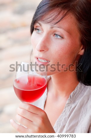 Woman drinking wine outdoors in wine provence in vacations