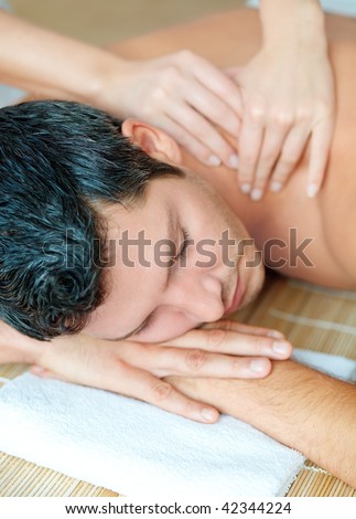 Relaxing man enjoying wellbeing wellness spa therapy