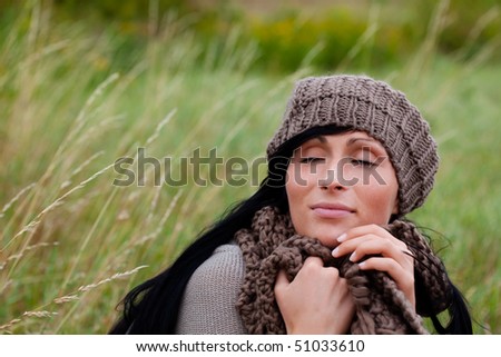 Woman relaxing outdoor in windy spring time relaxing freetime