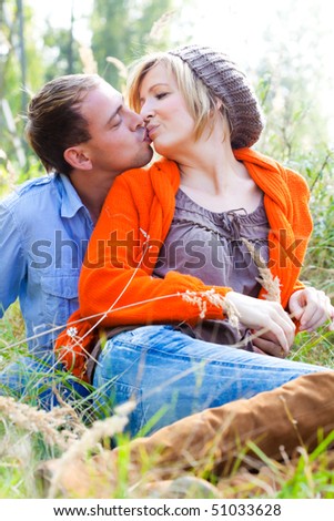 Healthy embracing nature sitting couple