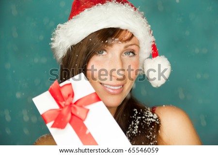 Happy female angel wth white wings holding present gift