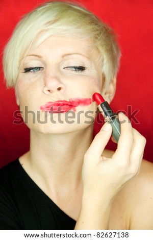 putting lipstick on