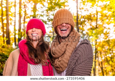 funny laughing couple hidden faces