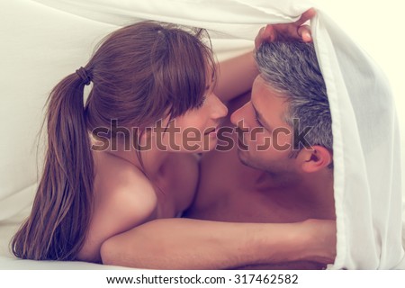 sensual lovers in bed making love