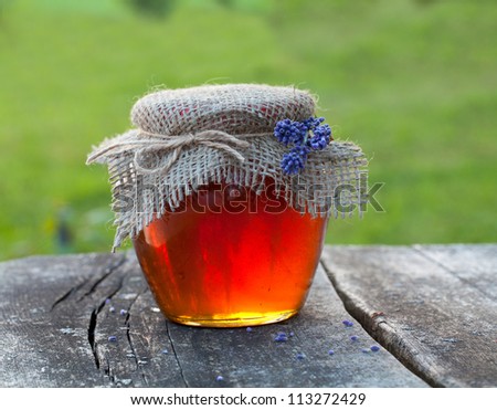 lavender honey on wooden garden table