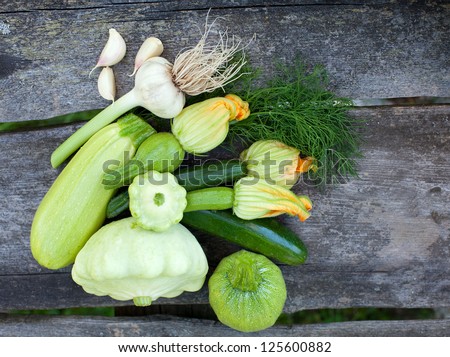 fresh zucchini fruits on wooden table