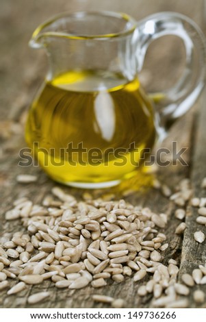 sunflower seed oil on wooden surface