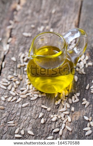 sunflower seed oil on wooden surface