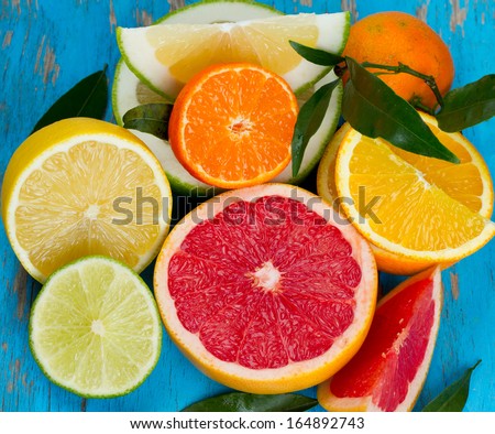 citrus fruit mix on blue wooden surface