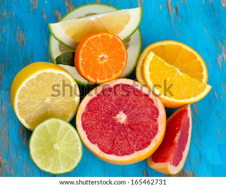 citrus fruit mix on blue wooden surface