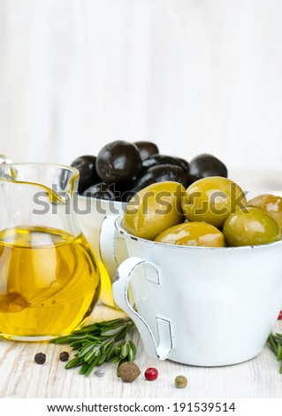 green and black olives on wooden surface